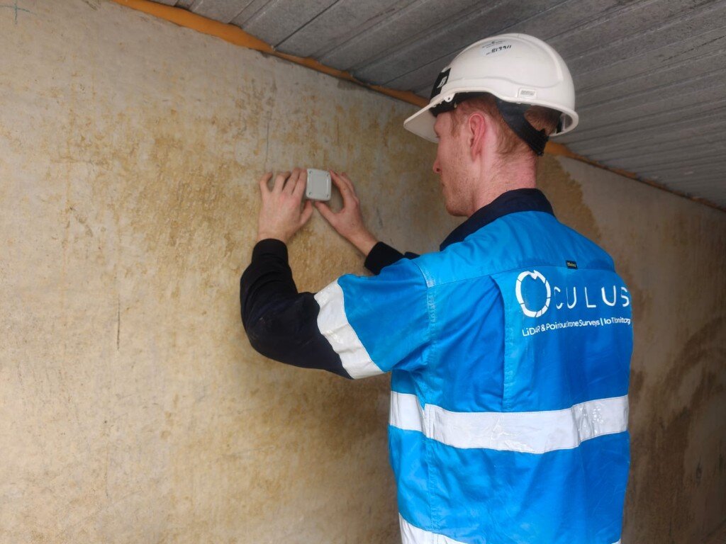Oculus engineer installing a monitoring sensor on site